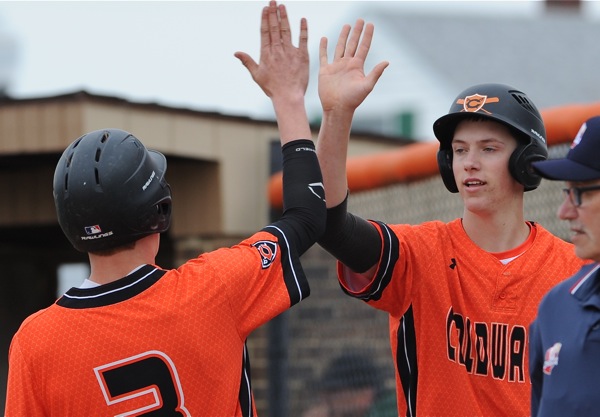 Dylan Thobe (#3) receives congratulation for his RBI triple in the