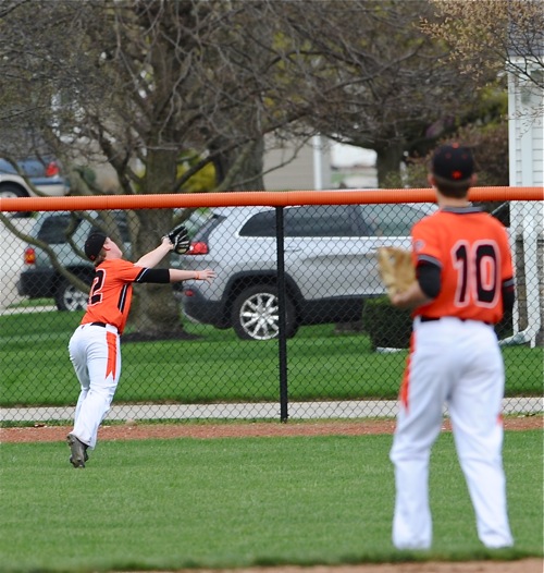 Coldwater second baseman Jacob Wenning watches teammate Doug Giere run down a shot to right field by Bryce Schmiesing in the second inning.