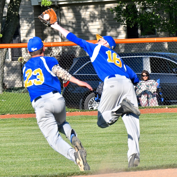 Marion's Matt Rethman (above, right) tries to get his glove on a ball that fell for a base hit in the fifth inning.