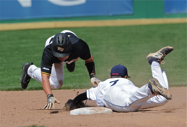 Brantley Johnson alertly tags a VCU runner out after oversliding second base.