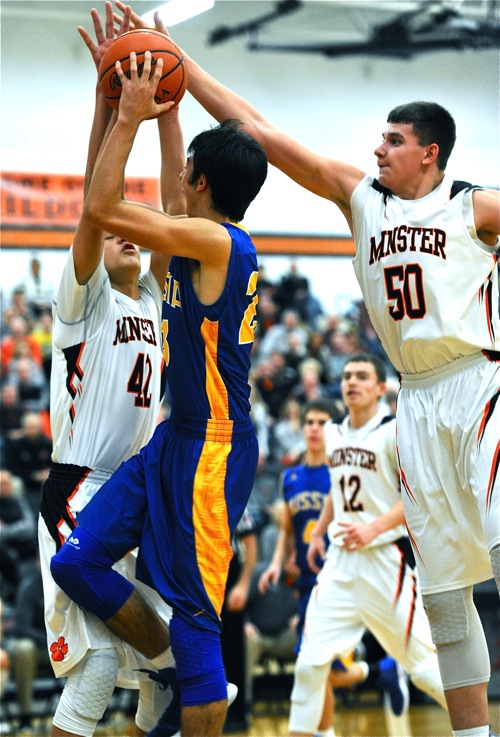 Minster's 'bigs', Cody Frericks (#42) and Jarod Schulze (#50) made scoring tough in the post.
