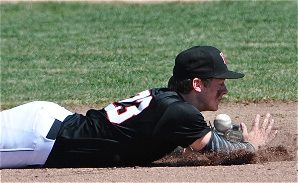 Loramie Devin Wehrman came this close to a diving stop on a Minster base hit in the fifth inning.