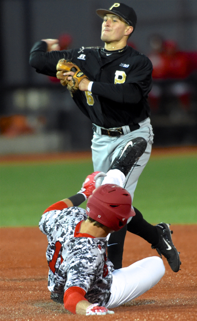 Shea Murray does his best to break up a double play attempt by Purdue's Harry Shipley.
