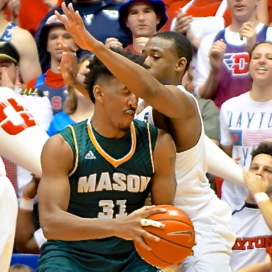 George Mason's Jalen Jenkins gets an under-arm-full of defense from Kendall Pollard.