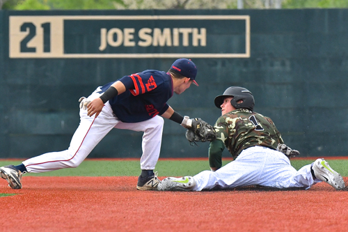 UD's Nick Ryan tags a Wright State runner, who looks up for the call.