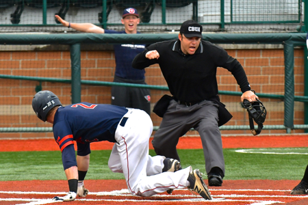 Robbie Doring was called out at the plate; the guy in the background thought differently.