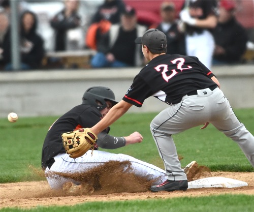 Versailles Noah Grisez steals second in the Tigers' five-run fourth.