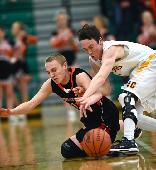 Alex Wendel battles DC's Matt Welker for a loose ball in the first half.