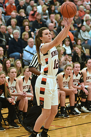 Minster's Hayley Baumer puts up a three-point shot during the Wildcats' 48-42 win over Fort Recovery. (Photo by Dale Barger)