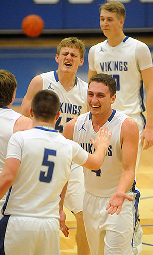 Ryan Haney and the Vikings celebrate a 63-47 win over Bethel.