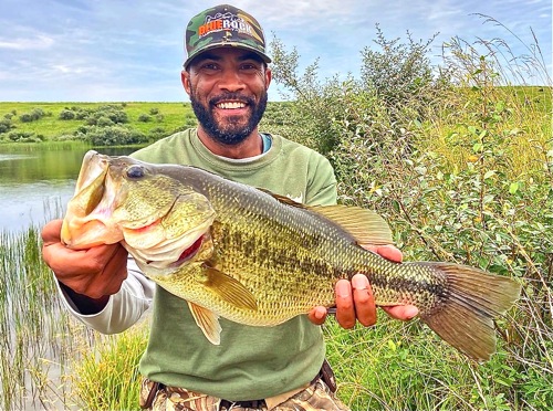 Small boy hooks a big bass in Findlay