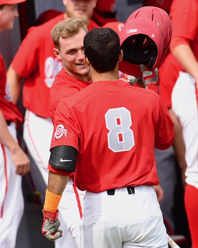 Noah West is congratulated on his first collegiate homer, coming in third inning of the first game.