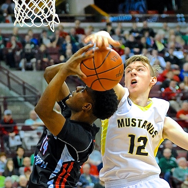 Lynchburg's Eric McLauglin rejects VASJ's Andre George.