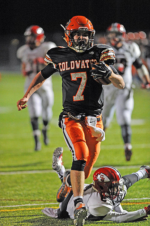Dylan Thobe steps through the would-be tackle attempt of a Coschocton defender on his way to his 56-yard score.