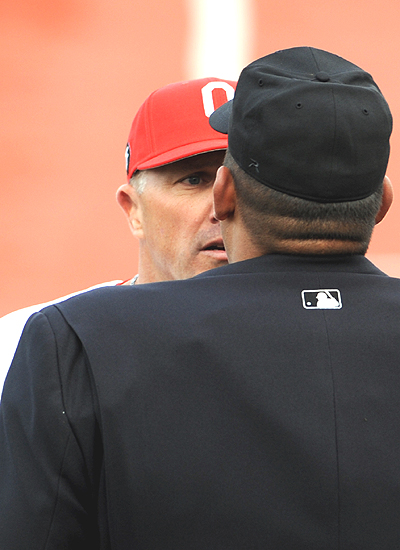 I saw it different....Greg Beals and plate umpire Kyle Reese disagree over an interference call at home plate in the fifth inning.