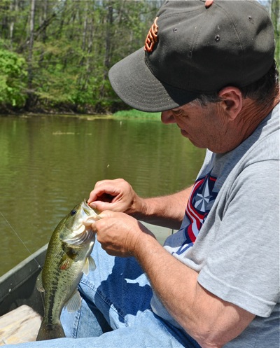 Fishing is like hitting the lottery.  You never know what'll hit, like this small bass that struck our bluegill jig.