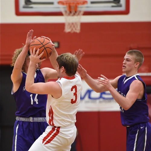 St. Henry's Mitch Schwieterman get's stymied by a Recovery double team during Tuesday's second half.