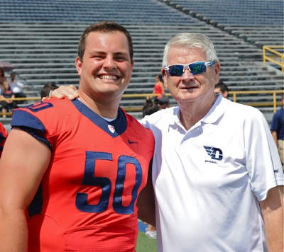Minster's Wes Hegeman (#50) mugs with Hal McCoy during Sunday's media day.