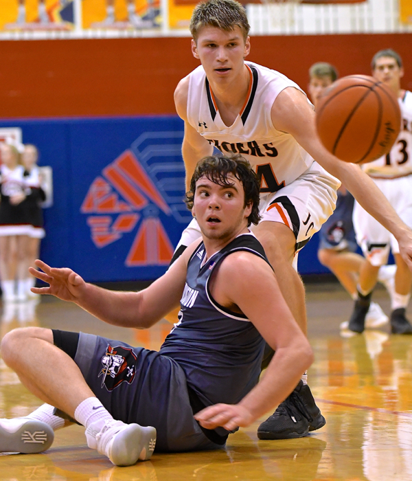 Both Brady Wildermuth and Trent Miller ready to make a move on a loose ball in play.