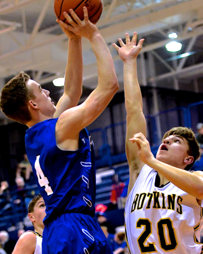Drew Brautigam up for two over Botkins defense Cole Opperman.