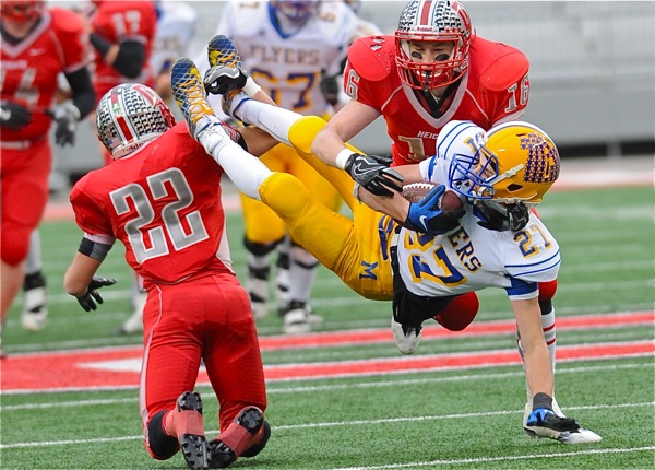 Titles come with hard knocks. Ask Marion's Ryan Thobe, who got flipped after this catch, but held onto the football.