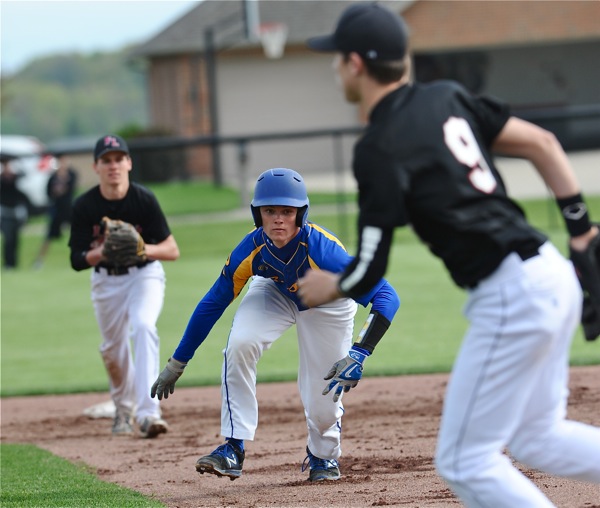 No man's land...Russia's Clay George found himself trapped between a pair of Loramie infielders.