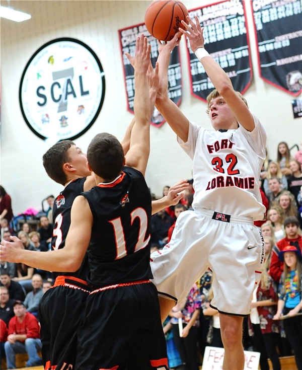 Dillon Braun pulls up for a pair of baseline points.  His 12 led the Redskins in scoring.