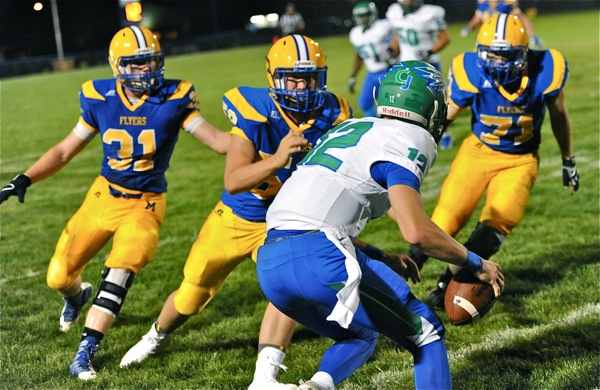 CJ quarterback Ryan Peltier looks up to see a Flyer greeting party on this pass attempt in the fourth quarter.