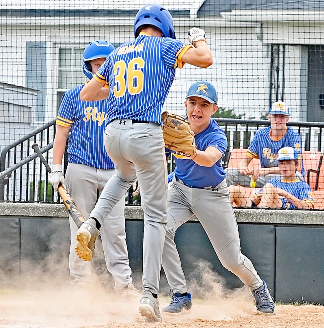 Marion Local's Lucas Homan gets as close to home plate as any Flyer got, but Eli Shappie tags him out.