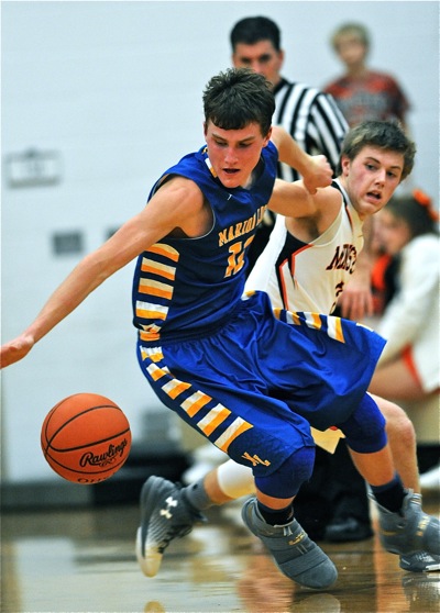 Marion's Collin Everman strips the ball away for a second quarter steal.