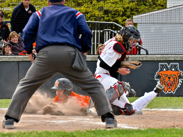 Safe at home plate gives Minster one for the score.