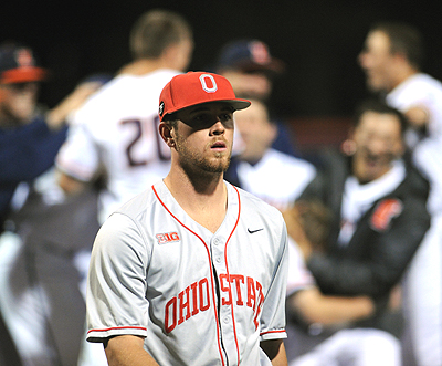 While some partied...Buckeyes reliever Kyle Michalik walked off the tough-luck loser in Friday's opener in Illinois.