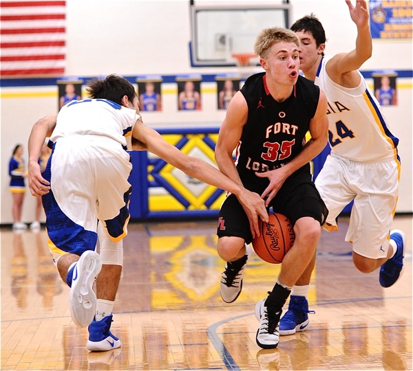 Ooooh, that special feeling...Loramie's Cody Gasson reacts to too many hands and the basketball...in the wrong place.