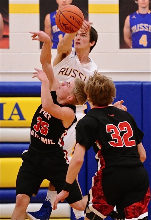 Russia's Jack Dapore slaps away the first half shot attempt of Loramie's Cody Gasson.