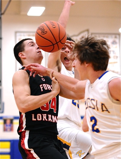 Who Nose?  Loramie's Nathan Pleiman finds congestion trying to score against a pair of Russia defenders.