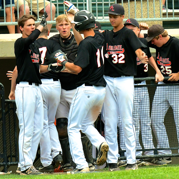 Carter Siegel (#11 ) is greeted by his teammates after his 2nd hit & run of the game.
