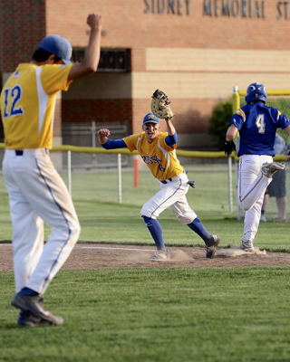 Russia pitcher Jack Dapore raises his fist in celebration as first baseman Hunter Lohee squeezes the final out in the Division IV sectional final win.