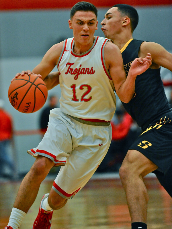 Hayden Kotwica feels the pressure from Andre Gordan