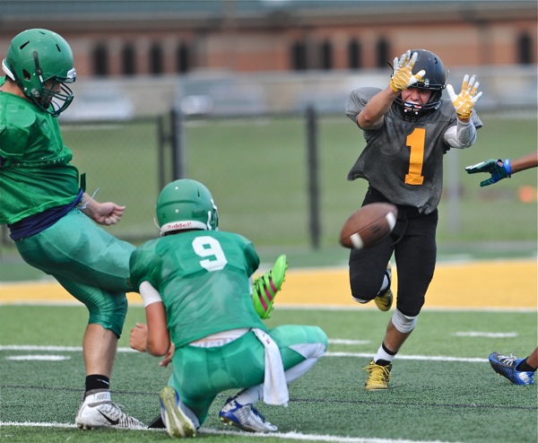 Sidney's Conor Beer (#1) was a step short on his block attempt of an extra point.