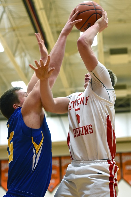 Goshen played tough in the early going, contesting the shot attempt of the Redskins' Tyler Schlarman.