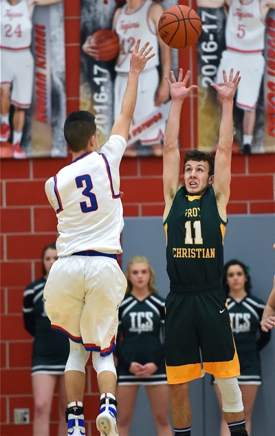 Hands Up, Don't Shoot...but the Patriots' Dillon McCullough let fly, anyway, over TC's Seth Wynne.