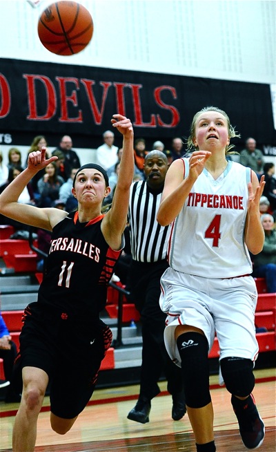 Tigers' guard Camille Watren slaps the ball away from Taylor Prall, denying another open look at the basket.