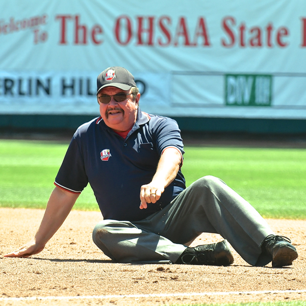 How they're callin' em at the tournament.  Umpire Rick Merb made the out call at first base in leisurely fashion...after falling down.