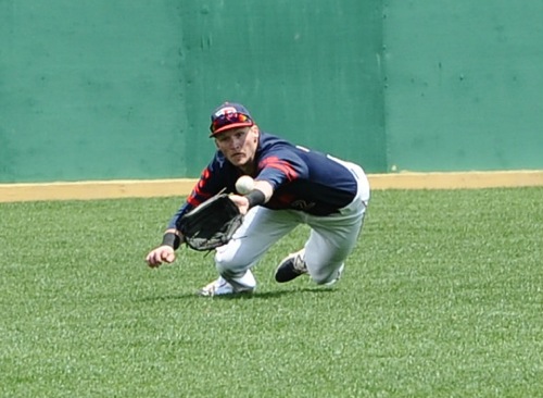 There is no quit...centerfielder Robbie Doring leaves his feet to make a diving catch attempt against VCU.
