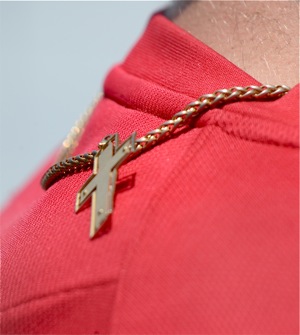 I've got your back...a crucifix on the back of UD's Aaron Huesman signifies hope and better days ahead for Flyer baseball.