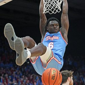 Enoch Cheeks swings on rim after a vicious slam dunk.