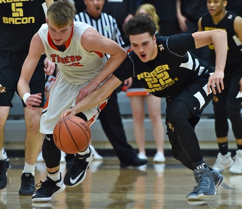 Roger Bacon's Justin Johnson pilfers the ball from Justin Ahrens in Wednesday's regional loss.