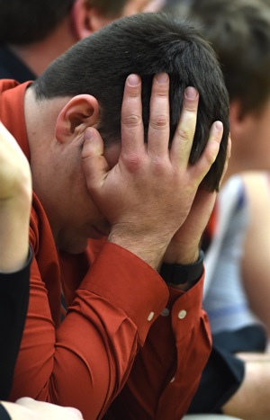 Painful...assistant coach Josh Langston hides his frustration as the clock ran out on the Tigers' season.