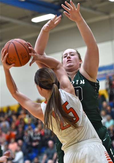 Lindsay Winner against the formidable post presence of Badin's Emma Broermann.