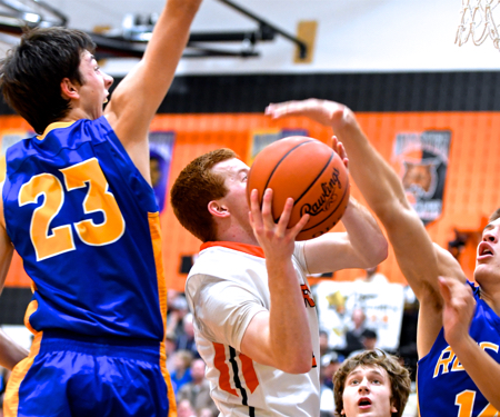 Keaton McEldowney scores 12 for the Tigers and had to work at it with the Raider's defenders on him all night.